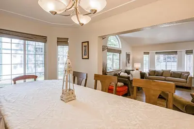 a dining room and living room with a dining table at Montgomery Estates Ski & Beach Haven in South Lake Tahoe