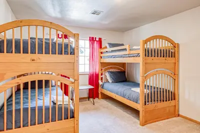 a bedroom with two bunk beds and a bed at Montgomery Estates Ski & Beach Haven in South Lake Tahoe