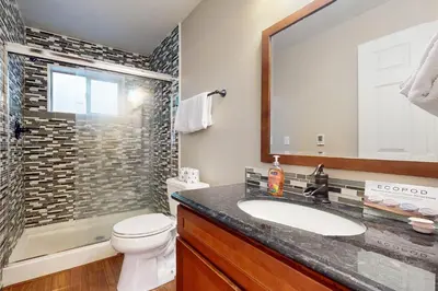 a bathroom with a sink and a toilet and a shower at Cellador Charms in South Lake Tahoe