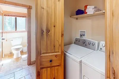 a laundry room with a washer and dryer at The Bear's Lair House in Truckee