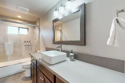 a bathroom with a sink and a mirror at Arrowhead Adventures in South Lake Tahoe
