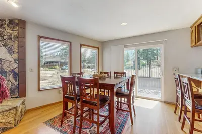 a kitchen and dining room with a table and chairs at Azure Palace in South Lake Tahoe