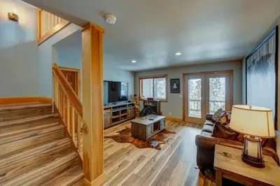 a living room with a couch and a tv at Heaven by the Lake in Truckee