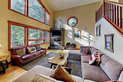 a living room with a couch and a table at Cherry Hill Charms in South Lake Tahoe