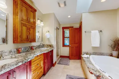 a bathroom with two sinks and a tub at Cherry Hill Charms in South Lake Tahoe