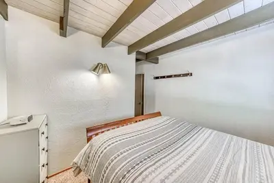 a bedroom with a bed and a ceiling at Livin' The Dream at 7000 ft in Lakeshore