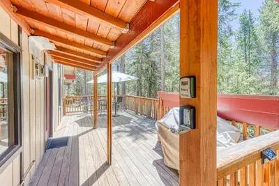 a wooden porch with a desk on a deck at Livin' The Dream at 7000 ft in Lakeshore