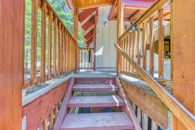 an inside view of a house with wooden walls and stairs at Livin' The Dream at 7000 ft in Lakeshore