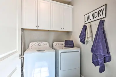 a laundry room with a washer and dryer at Relaxing Roseville Home with Outdoor Amenities in Roseville