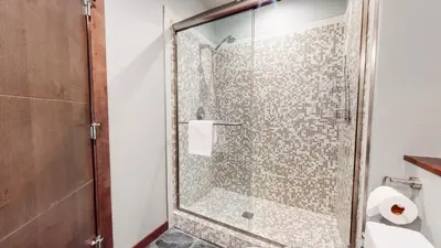 a shower with a glass door in a bathroom at Solstice #14 condo in Mammoth Lakes