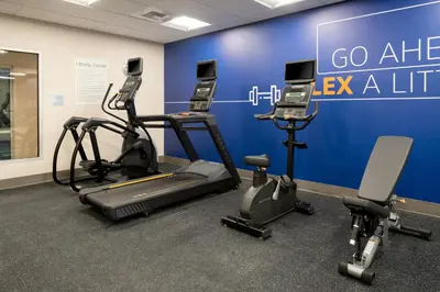a gym with cardio equipment and exercise bikes at Holiday Inn Express & Suites - Hollister by IHG in Hollister