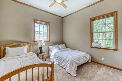 two beds in a room with two windows at Cascadel Haven in North Fork