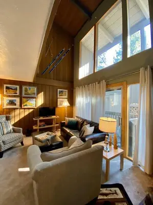 a living room with a couch and a table at Mammoth Awesome Location-1 min to Shuttles & Food! TOML-CPAN-11402 in Mammoth Lakes
