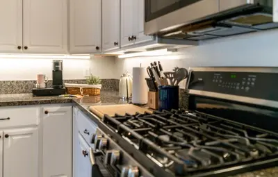 a kitchen with a stove top oven in a kitchen at Boho Townhome in Carson City 10 Mins From Downtown, 30 Mins To Lake Tahoe in Carson City