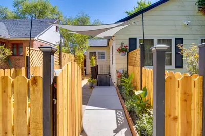 a wooden fence in front of a house at Ski and Hike Cozy Dtwn Reno Studio with Fireplace in Reno