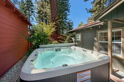 a hot tub in the backyard of a house at Manzanita Holiday 3 in South Lake Tahoe
