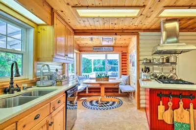 a kitchen with a sink and a table at Steps to Dtwn Murphys Cottage with Furnished Porch in Murphys