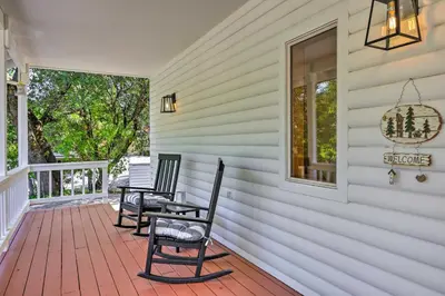 two chairs on the front porch of a house at Steps to Dtwn Murphys Cottage with Furnished Porch in Murphys
