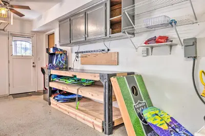 a room with a table and a surfboard in it at Balcony and Scenic View Sonora Hideaway! in Sonora