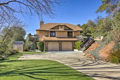 a house with a driveway and a garage at Balcony and Scenic View Sonora Hideaway! in Sonora