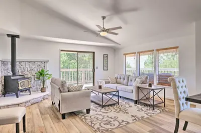 a living room with a couch and a fireplace at Balcony and Scenic View Sonora Hideaway! in Sonora