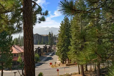 a street in a town with trees and buildings at Val D'Isere at the Village by 101 Great Escapes in Mammoth Lakes