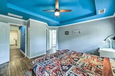 a bedroom with a bed with a blue ceiling at Charming Home Less Than 10 Mi to Sequoia Natl Park! in Three Rivers