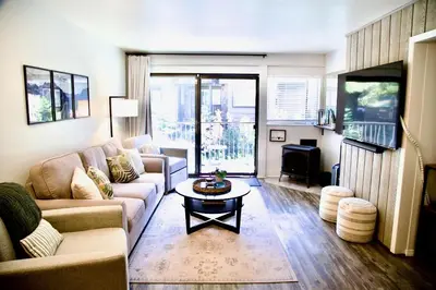 a living room with a couch and a table at St Anton Condos #77 condo in Mammoth Lakes