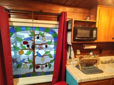 a kitchen with a stained glass window with a sink at O'Brien's Oasis in Miramonte