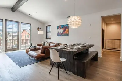 a living room with a couch and a table at Creekhouse 1334 in Mammoth Lakes