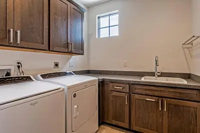 a kitchen with a white dishwasher and a sink at Creekhouse 1334 in Mammoth Lakes