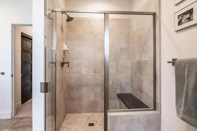 a shower with a glass door in a bathroom at Creekhouse 1334 in Mammoth Lakes
