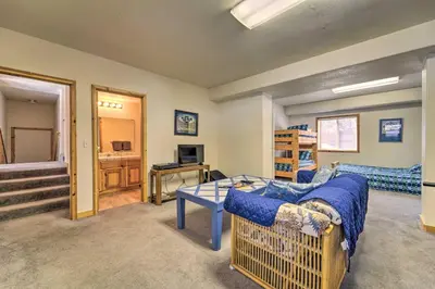 a living room with a couch and a table at Less Than 8 Mi to Donner Lake Home with Deck and Balcony! in Truckee
