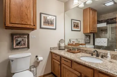a bathroom with a toilet and a sink at Mammoth Pines #7 Newly updated 2 Bedroom plus Loft, 3 Full Bathrooms, Sleeps 8 people in Mammoth Lakes