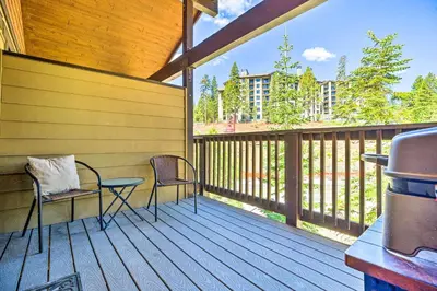 a porch with two chairs and a table on a deck at Luxe Mountain Home in Village, Steps to Gondola! in Mammoth Lakes