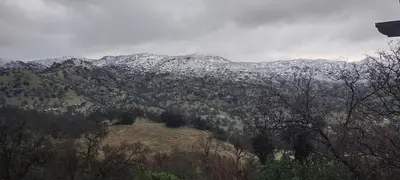 a view of a mountain with snow on it at Rustic Rooms by Kings Canyon & Sequoia National Parks in Squaw Valley