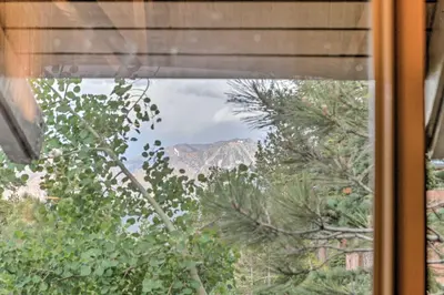 a view of a mountain through a window at Elegant Mountain-View Condo Less Than 1 Mi to Lifts! in Mammoth Lakes