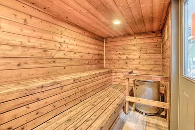 a wooden sauna with a trash can in it at Elegant Mountain-View Condo Less Than 1 Mi to Lifts! in Mammoth Lakes