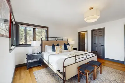 a bedroom with a bed and a window at Bennett Flat Adventure in Truckee