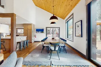 a dining room with a table and chairs at Bennett Flat Adventure in Truckee