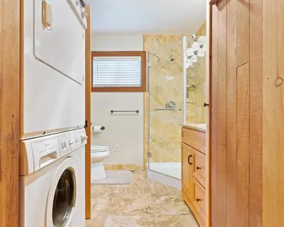 a washing machine in a bathroom with a shower at Amazing Views - Modern Home - SH #14 in Bear Valley