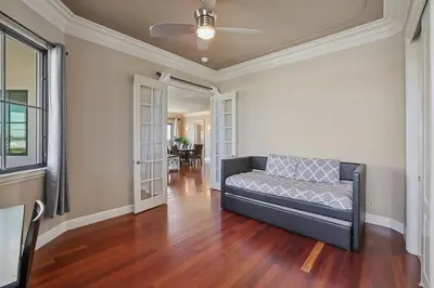 a living room with a couch on a hard wood floor at 4BR LUXURY ENTERTAINMENT OASIS in Tracy