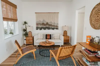 a living room with a white couch and chairs at Sunset Glow Hidden Meadow BBQ HotTub by Casa Oso in Oakhurst