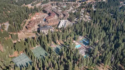 an aerial view of a resort in a forest at Arroyo by AvantStay Peaceful Mountain Townhouse w Large Private Balcony in Kingswood Estates