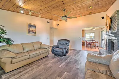 a living room with a couch and a fireplace at Waterfront Bethel Island Home with Dock and Slip in Bethel Island