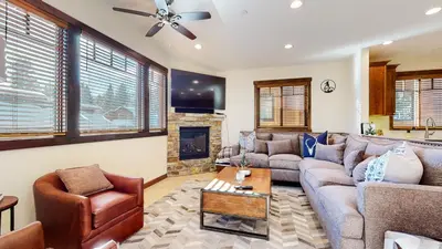 a living room with a couch and a fireplace at Lakeview Townhomes #5 townhouse in Mammoth Lakes
