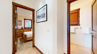 a bathroom with a door leading to a bedroom at Lakeview Townhomes #5 townhouse in Mammoth Lakes