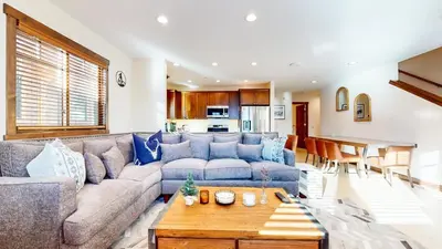 a living room with a couch and a table at Lakeview Townhomes #5 townhouse in Mammoth Lakes