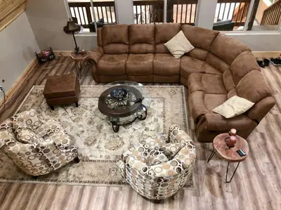 a living room with a brown couch and chairs at Modern Cabin Get Away - close to APPLE HILL in Pollock Pines