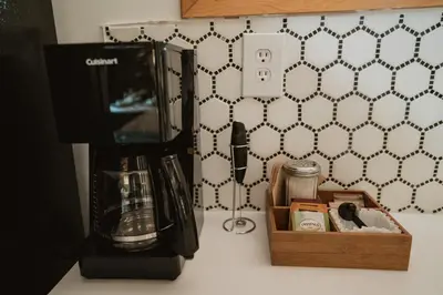 a blender on a counter next to a wooden box at Romantic Forest Lovers Nest by Casa Oso in Mariposa